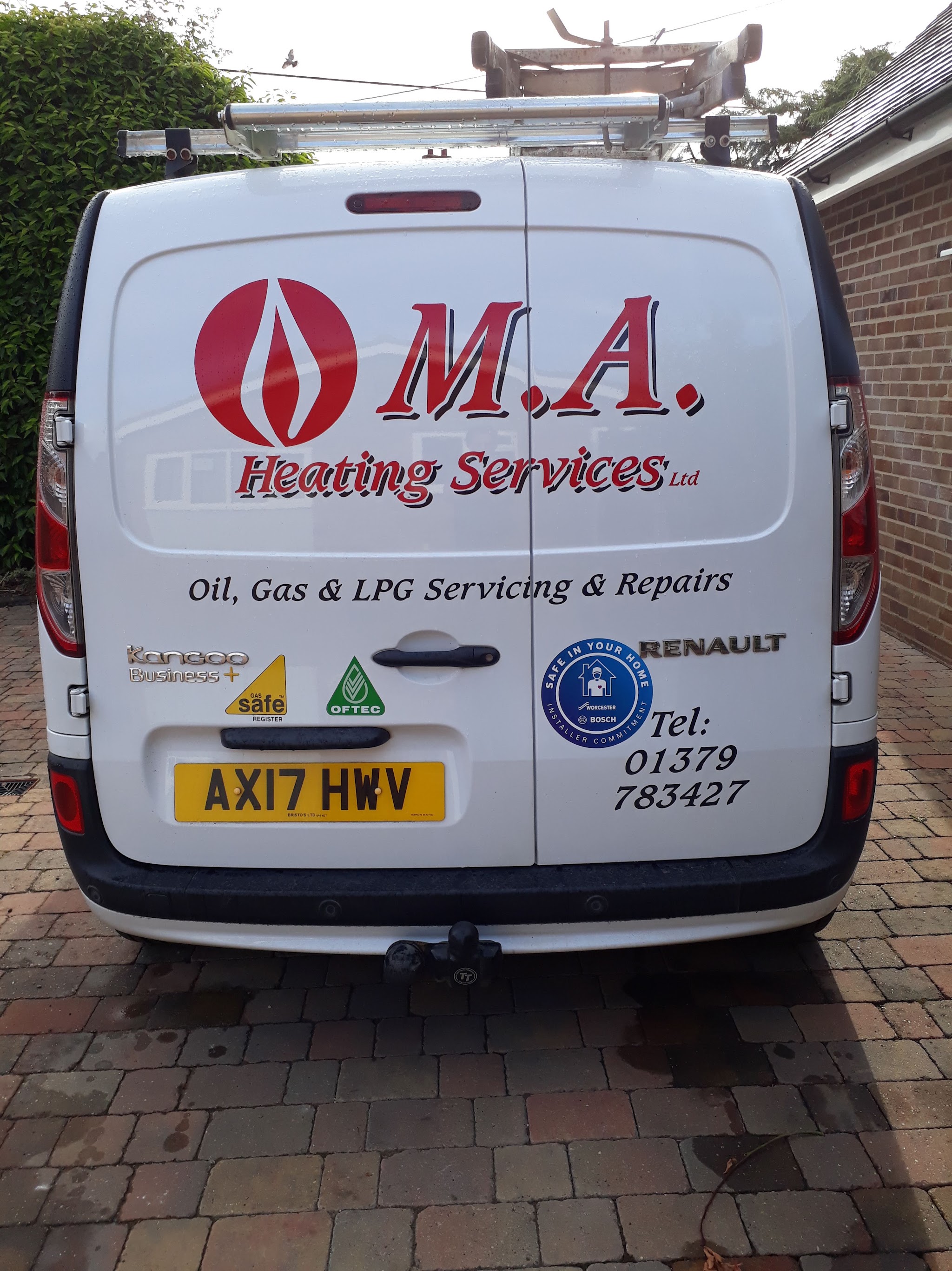 Rear doors of an MA Heating van: Oil, Gas and LPG Servicing and Repairs, with Gas Safe, OFTEC and Worcester Bosch badges