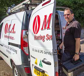 Mark Askew beside an MA Heating van